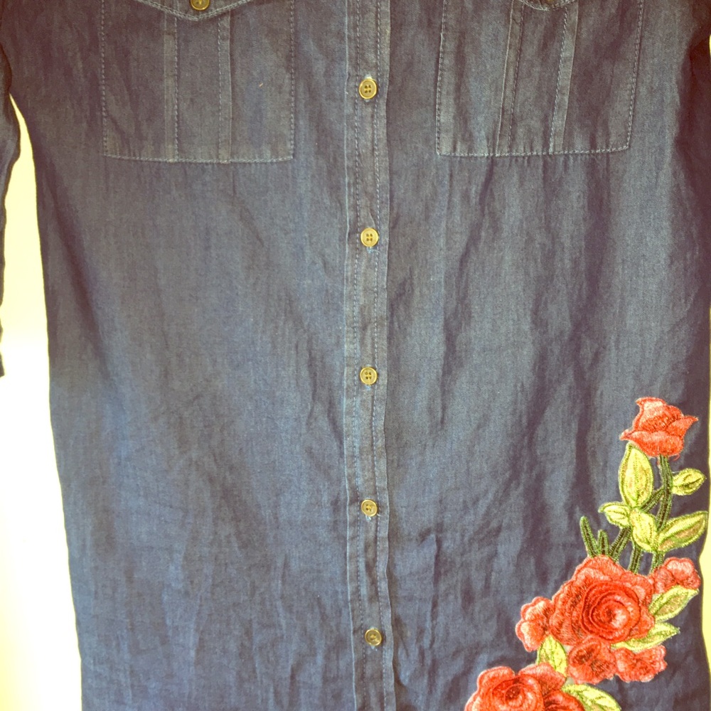 Jean dress with embroidery on it